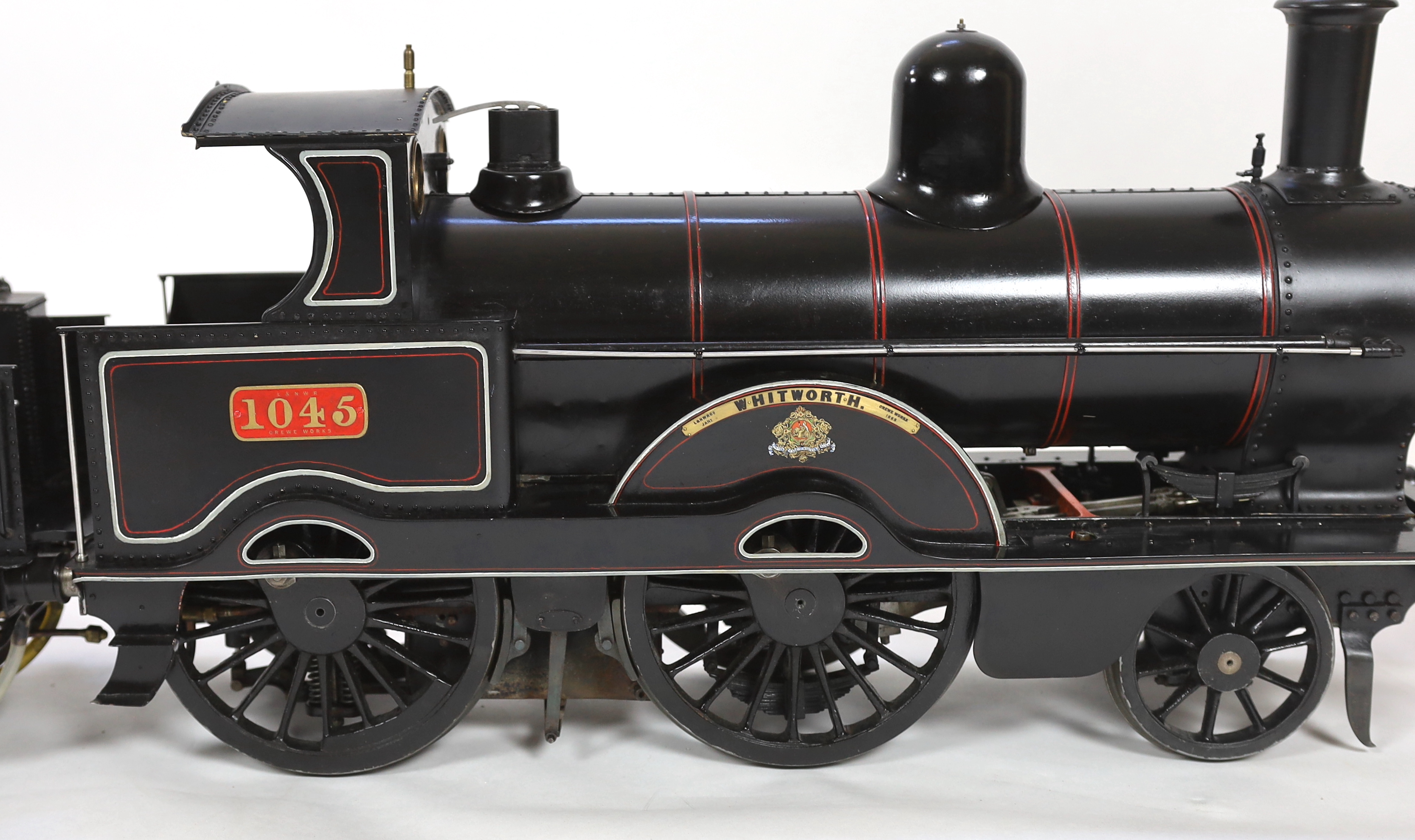 A very finely engineered scratch-built 5” gauge live steam model of a LNWR (London and North Western Railway) Jumbo 2-4-0 tender locomotive, No. 1045 ‘Whitworth’